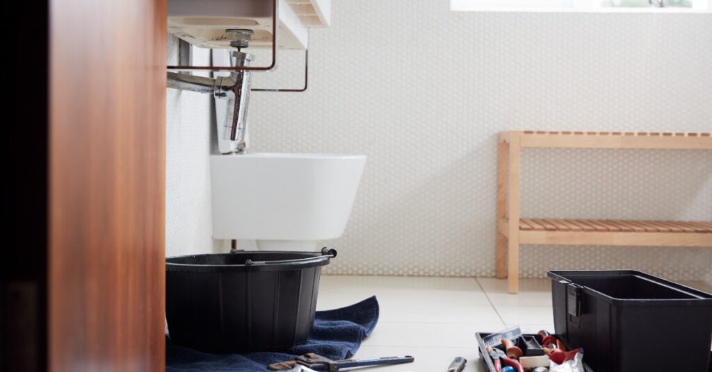 bucket under bathroom sink