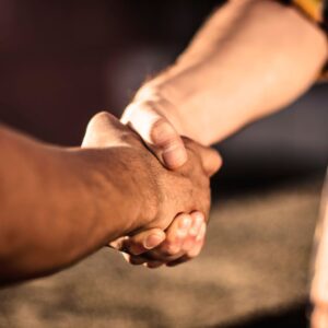 Plumber shaking hands with a customer