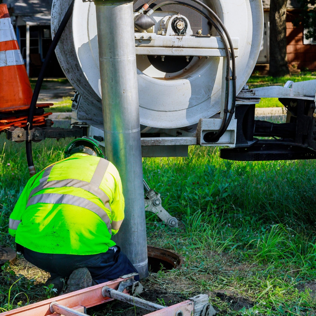 truck doing sewer repair in yard