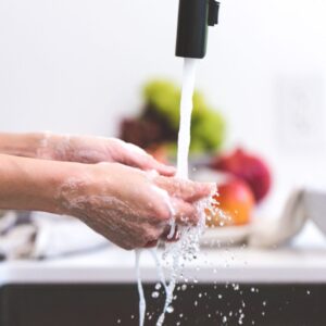 washing hands at sink