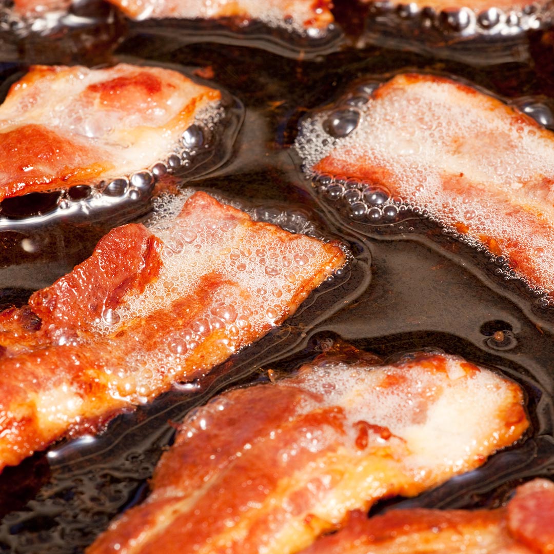 bacon cooking in a pan