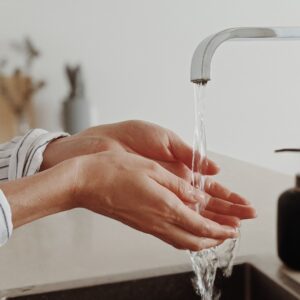 Woman washing her hands