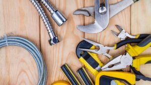 plumbing tools on wood
